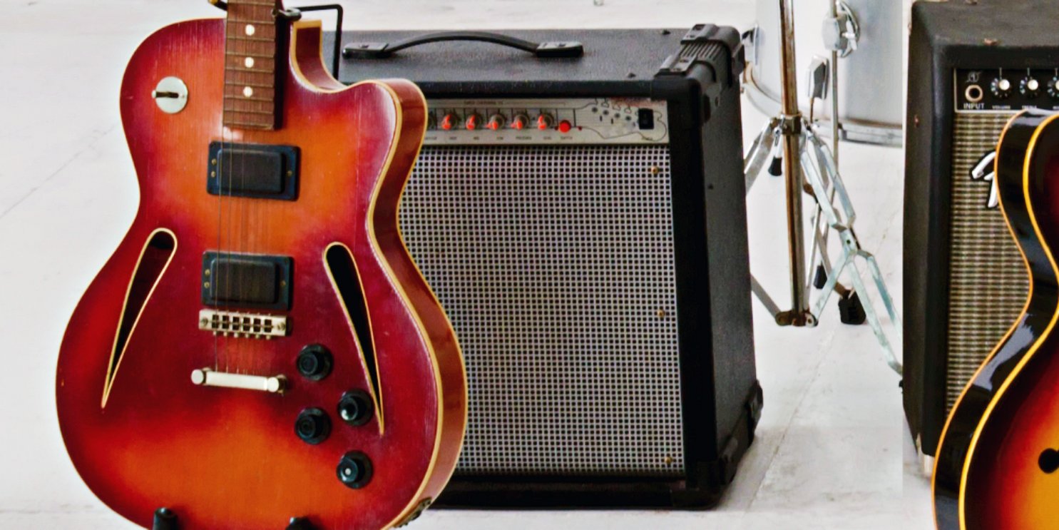 Guitar in front of an amp on a white background - Soulshine Amp Section