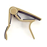 Dunlop trigger capo for 6 or 12 string acoustic guitars curved gold 83CG