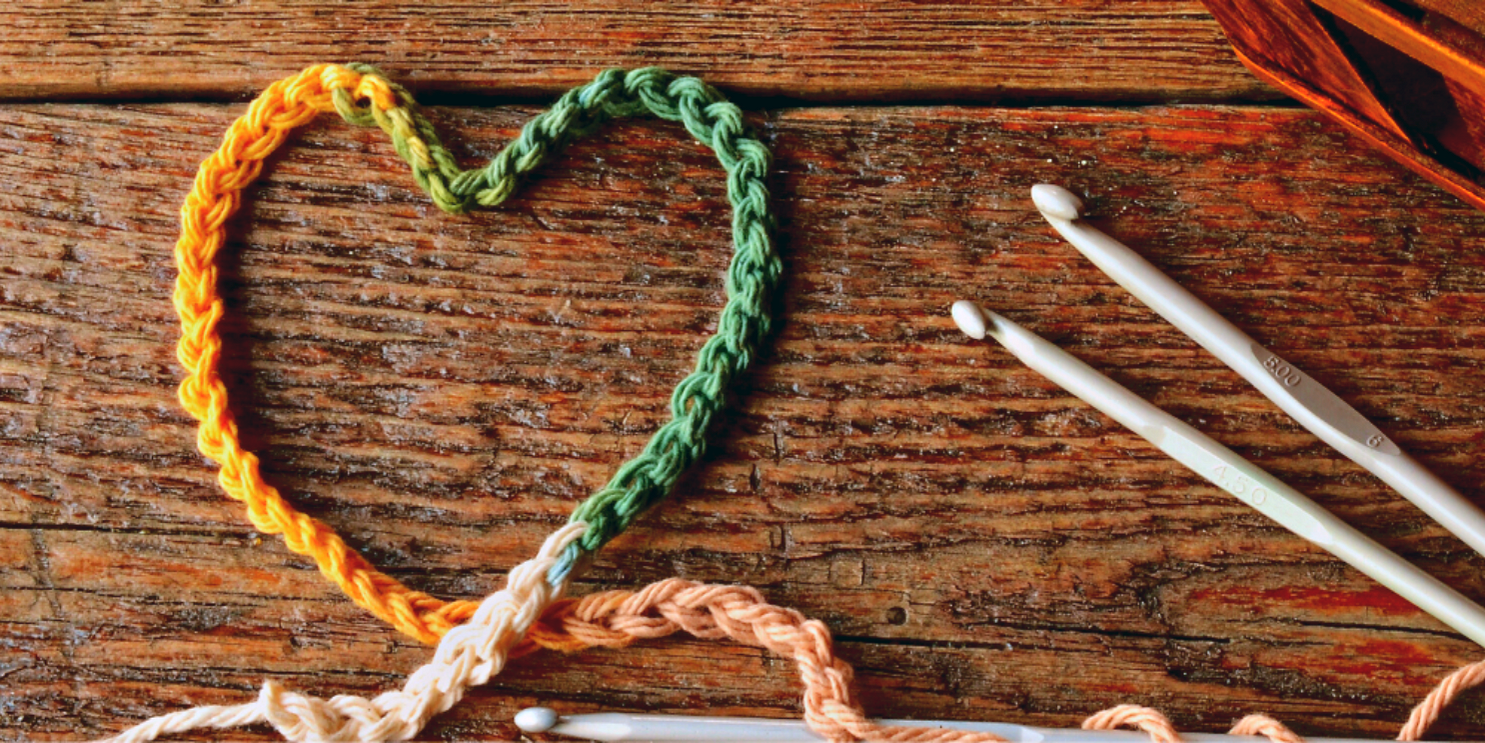 Heart shaped Yarn craft next to needles - Soulshine's Yarn and Supplies Section